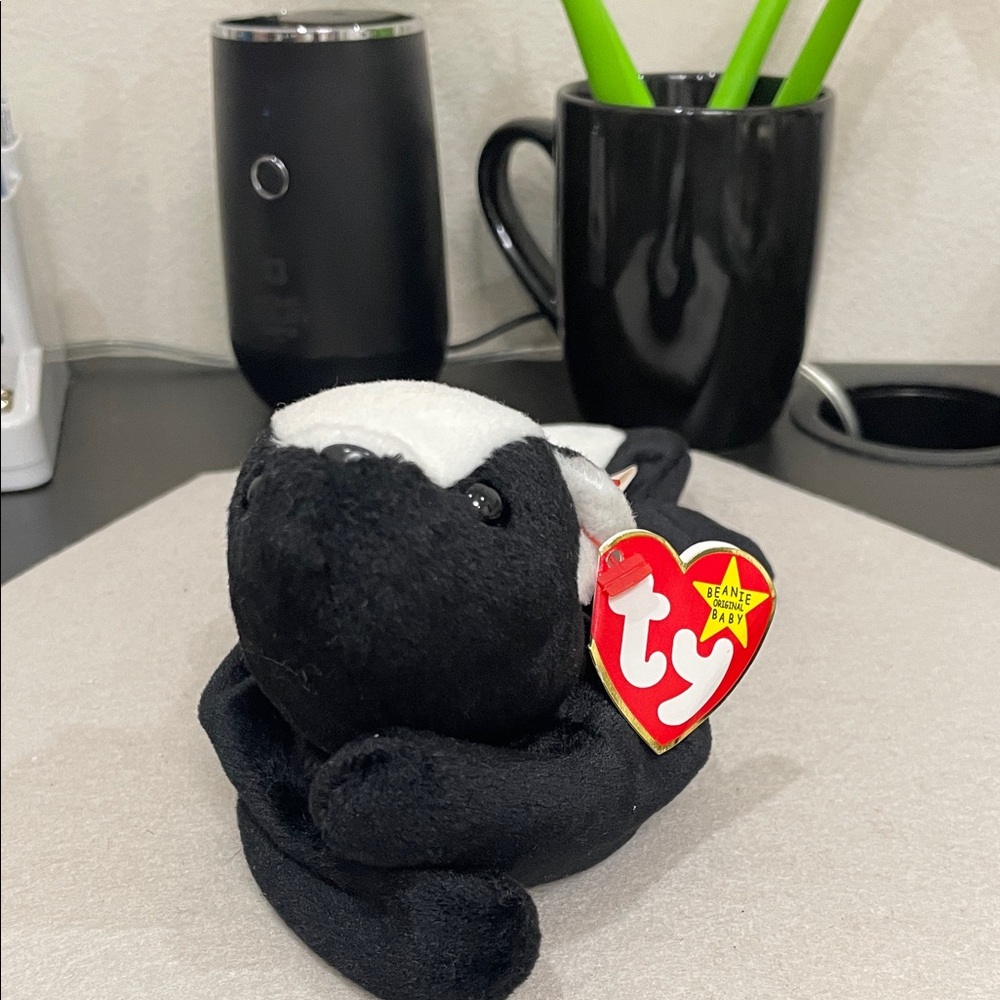Ty Black and White Skunk Plush with Heart Tag “Stinky” born in 1995